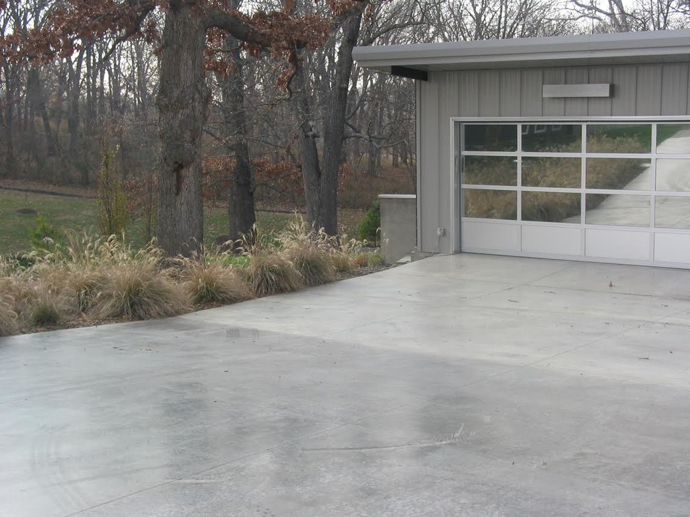 This is an example of a large contemporary attached double carport in Other.