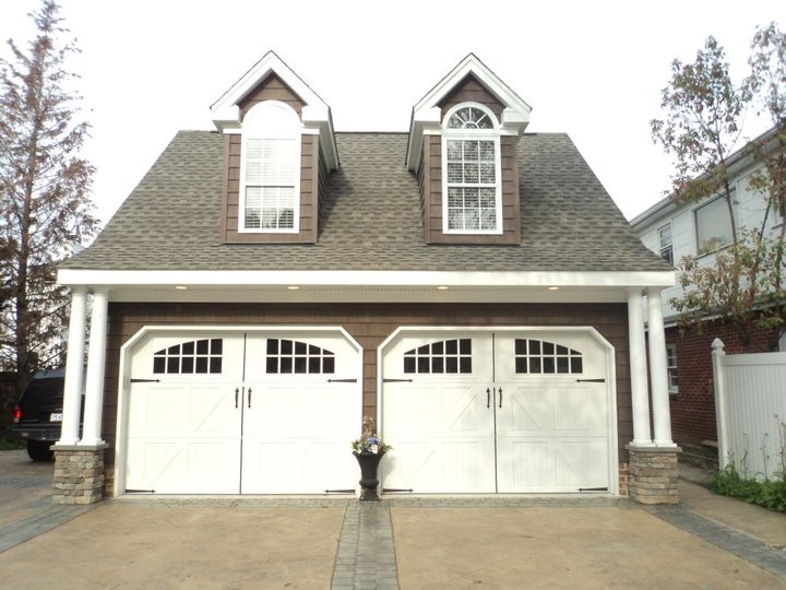 Example of a mid-sized classic detached two-car garage design in Other