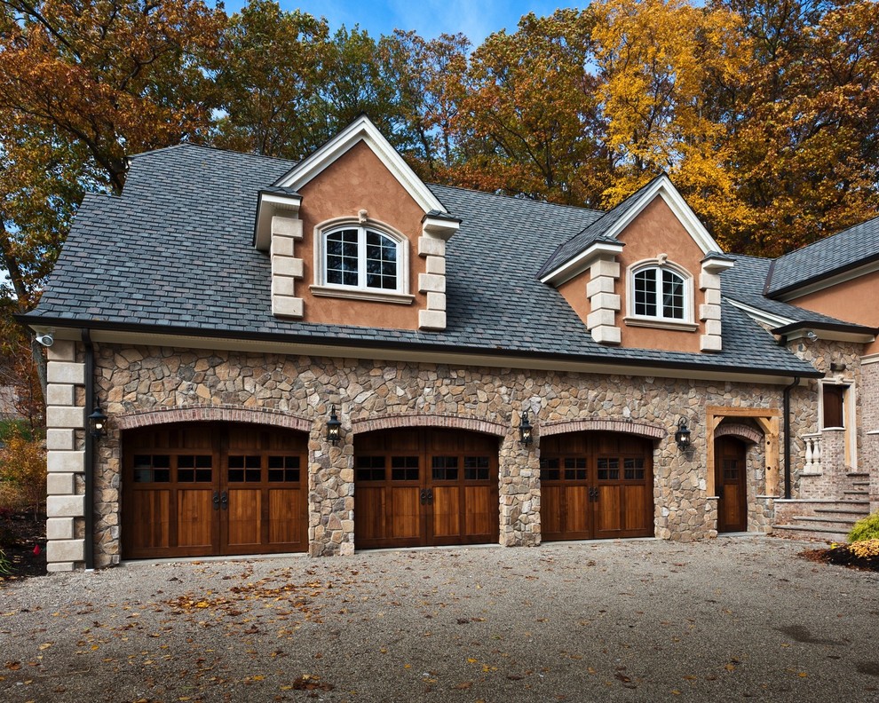 Large arts and crafts attached three-car garage photo in New York