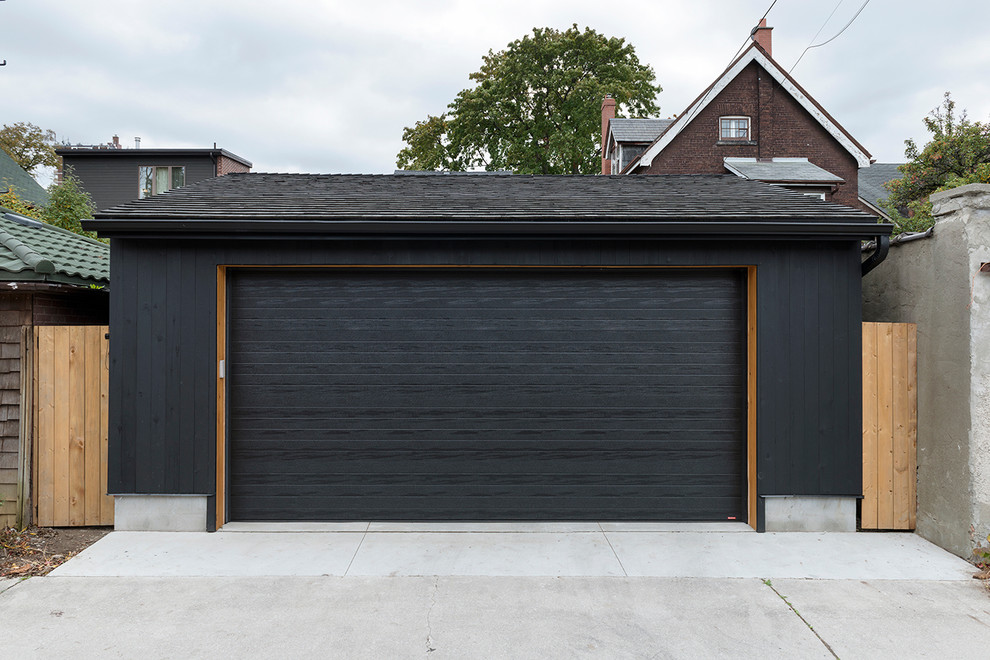 Immagine di un garage per un'auto indipendente minimalista di medie dimensioni con ufficio, studio o laboratorio