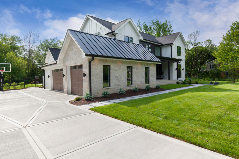 Inspiration for a large modern attached garage in Chicago with three or more cars.