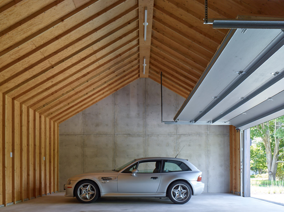 Exempel på en lantlig tillbyggd tvåbils garage och förråd