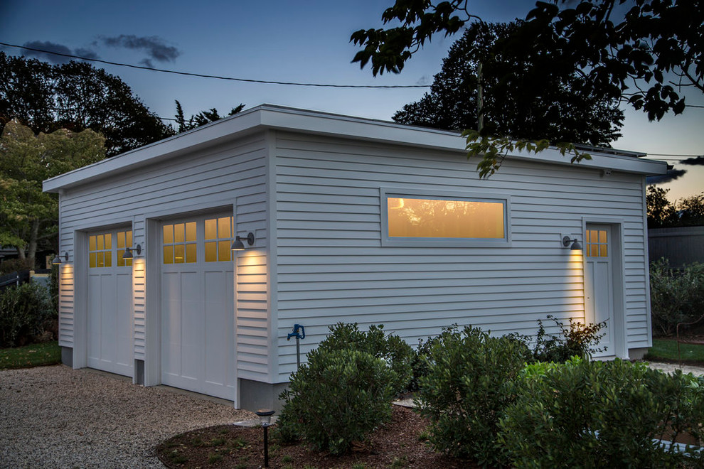 Example of a mid-sized beach style detached two-car garage workshop design in New York
