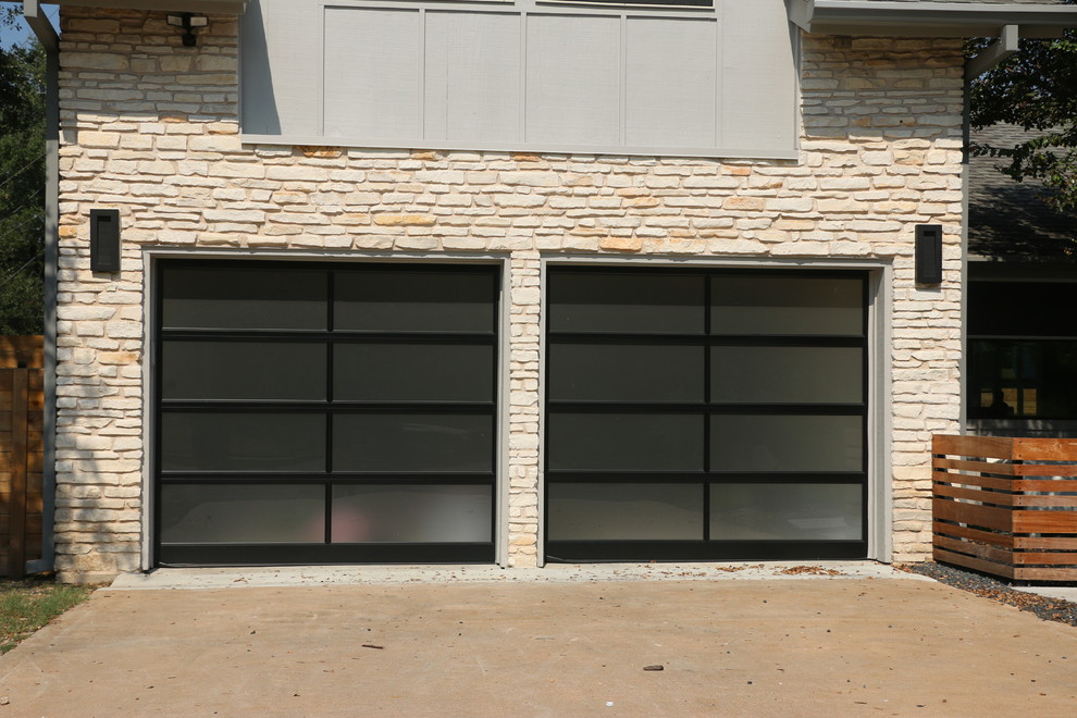 Photo of a medium sized contemporary attached double garage in Austin.