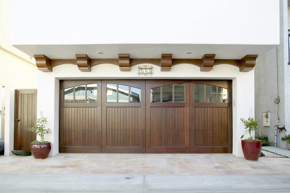 Example of a mid-sized tuscan attached two-car carport design in Los Angeles