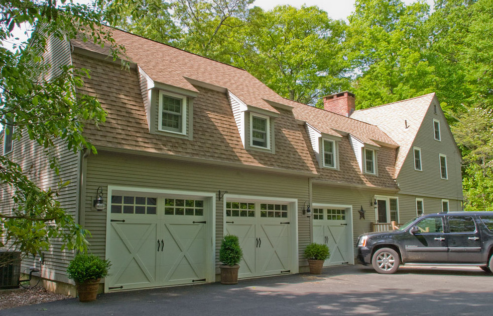 Example of a large country attached three-car carport design in New York