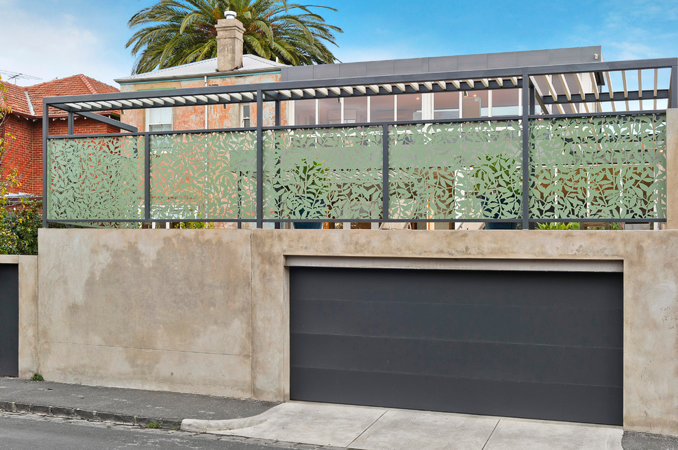 Photo of a large contemporary attached double carport in Melbourne.