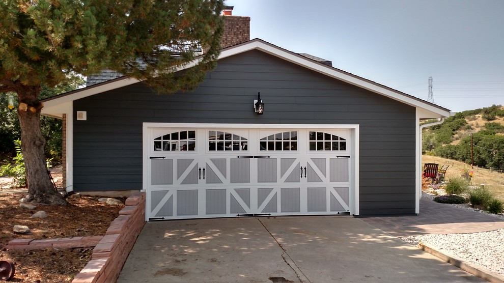 Garage - mid-sized country detached two-car garage idea in Denver
