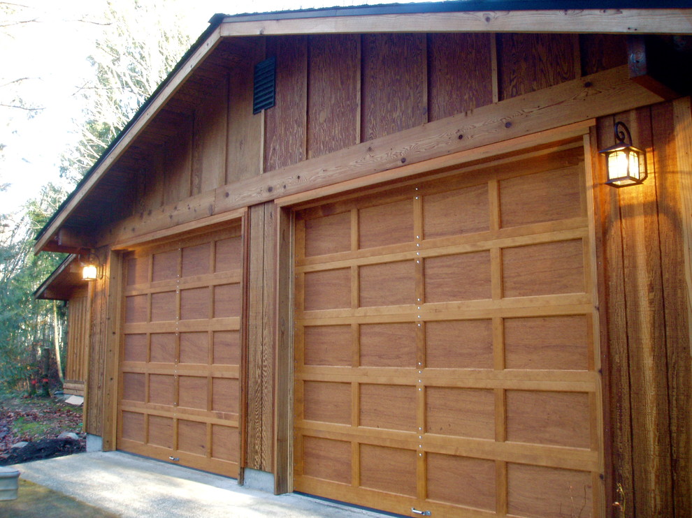 Example of a classic attached two-car garage design in Seattle
