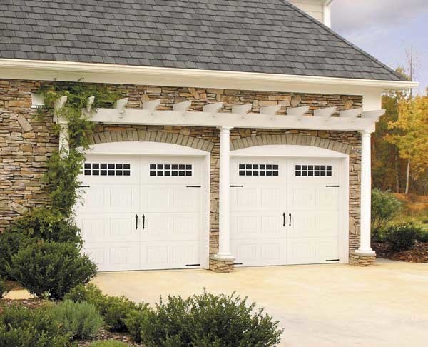 Inspiration for a medium sized classic attached double garage in Cleveland.