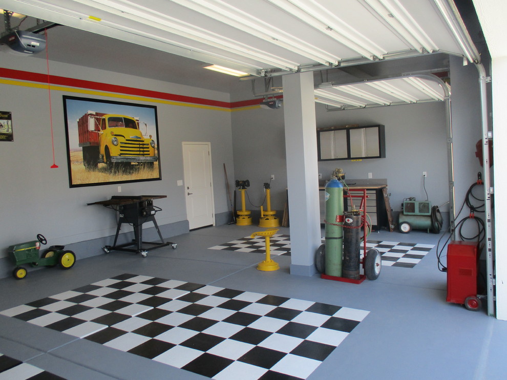 Design ideas for a large contemporary attached garage workshop in Austin with three or more cars.