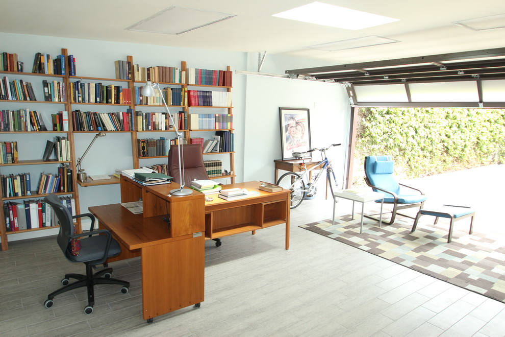 This is an example of a medium sized contemporary detached double garage workshop in Los Angeles.