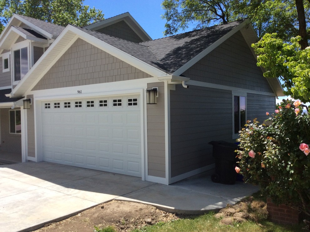 Garage - large transitional attached two-car garage idea in Salt Lake City