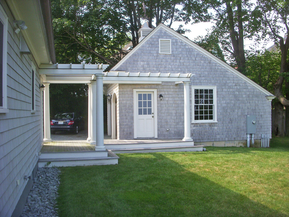 Example of a large classic detached two-car garage design in Providence