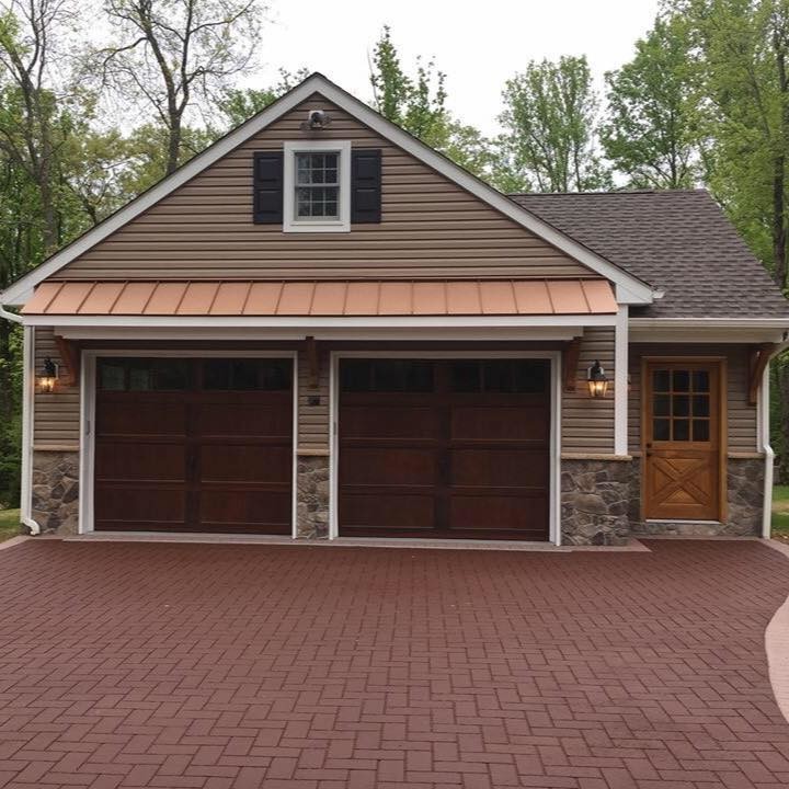 Photo of a large traditional detached double garage workshop in New York.