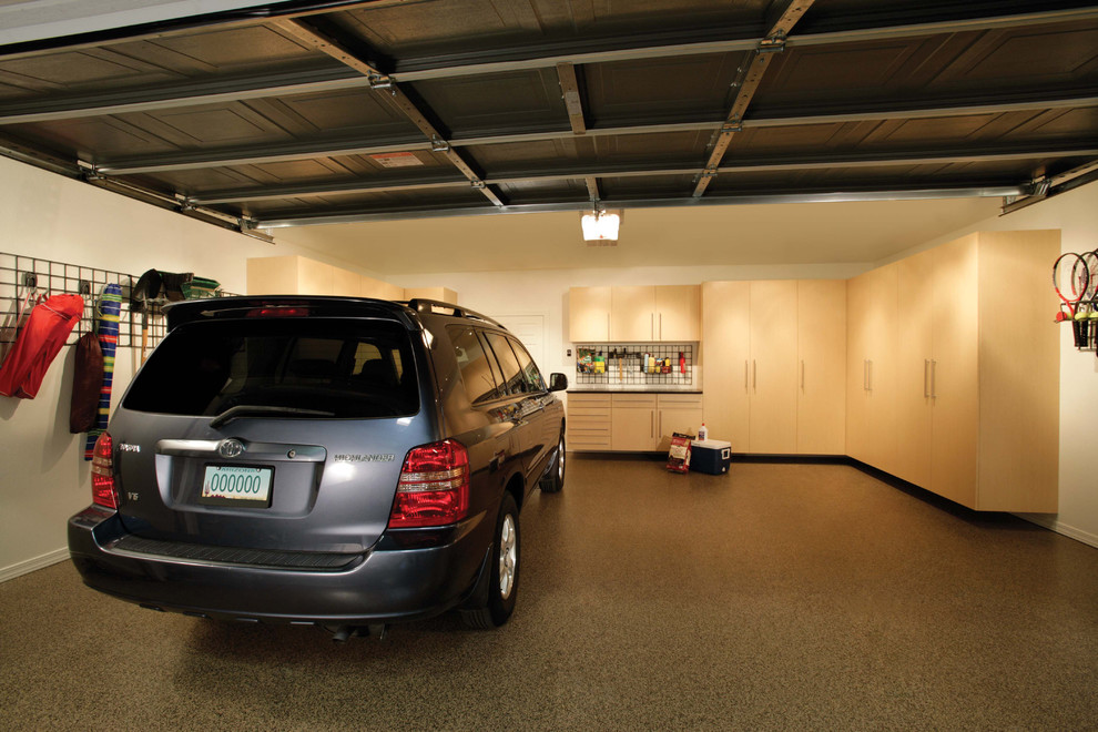 Inspiration for a large timeless attached two-car garage remodel in New York