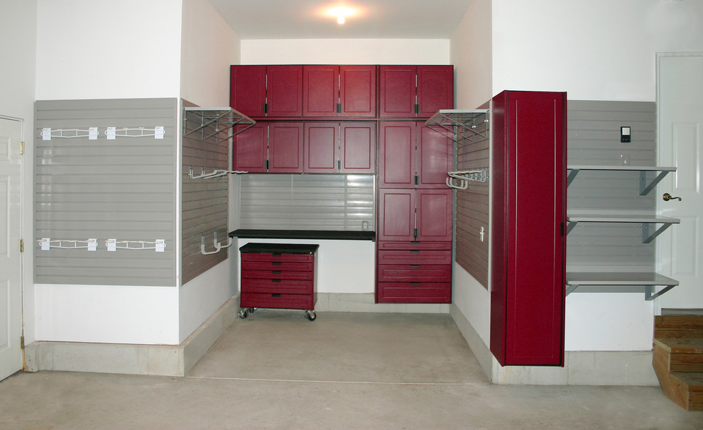 This is an example of a medium sized classic attached double garage workshop in Kansas City.