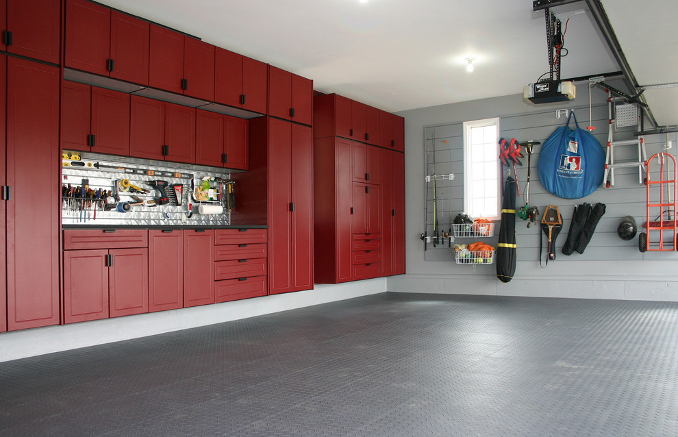 Large transitional attached two-car garage workshop photo in Kansas City