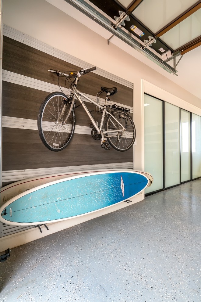 Inspiration for a mid-sized transitional attached two-car garage remodel in Hawaii