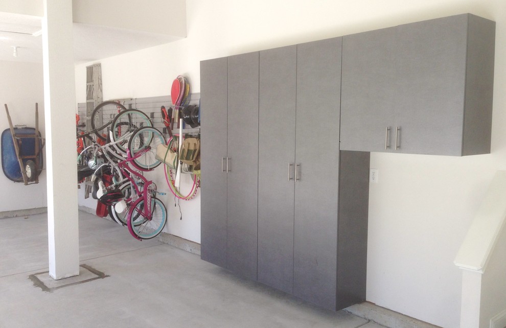Large trendy attached two-car garage workshop photo in Indianapolis