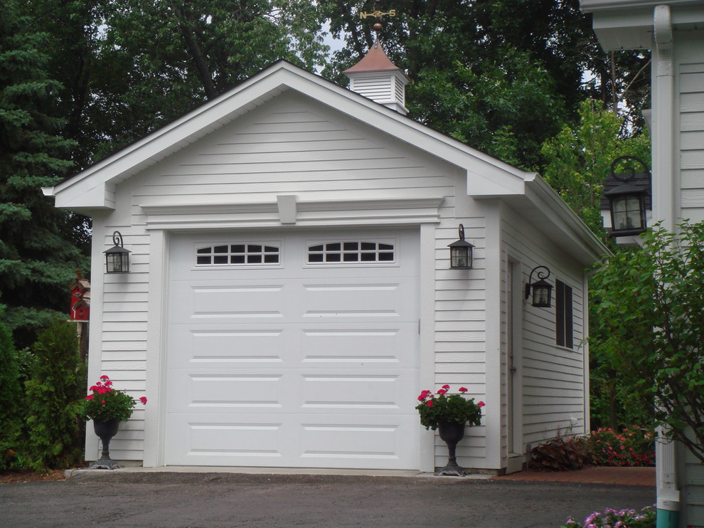 Example of a small classic detached one-car carport design in Chicago