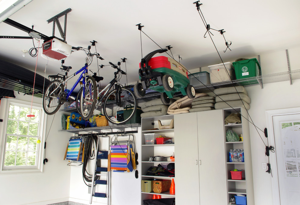 Garage - mid-sized contemporary attached two-car garage idea in New York