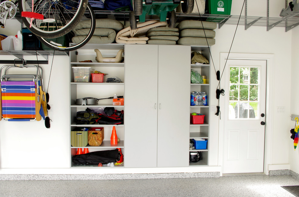 Garage - mid-sized contemporary two-car garage idea in New York