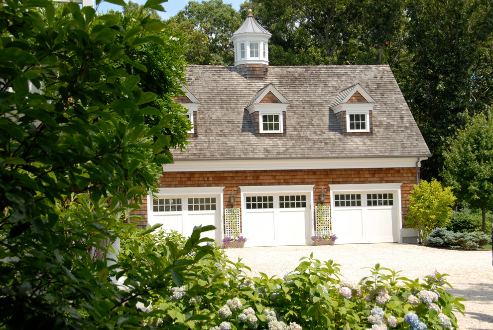 Beach style three-car garage photo in New York