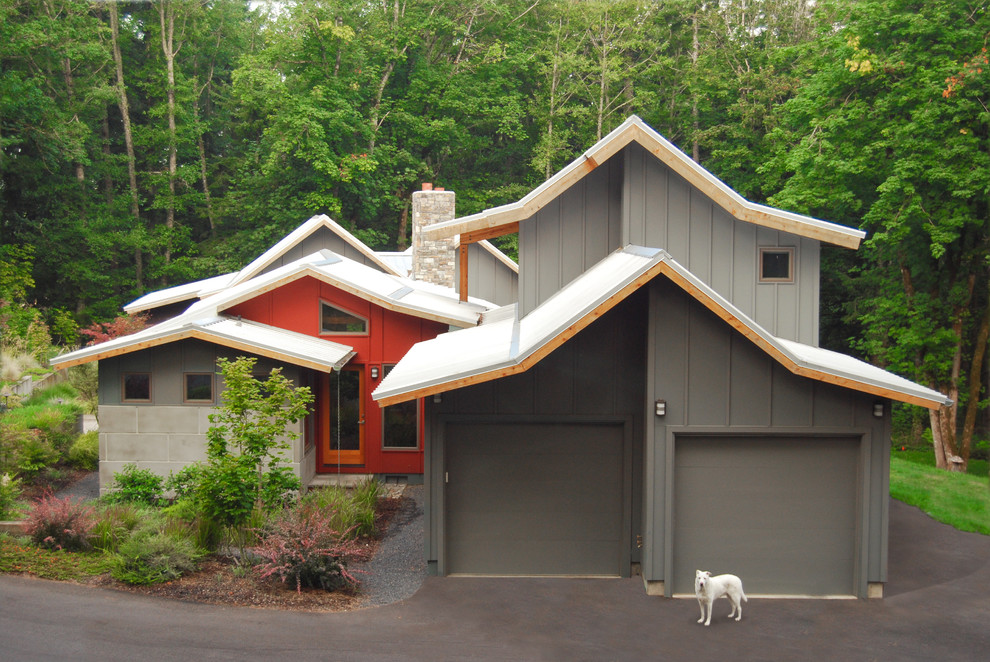Inspiration for a mid-sized contemporary attached two-car garage remodel in Portland