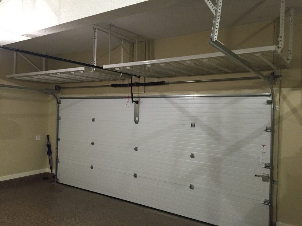 Photo of a medium sized classic attached double garage workshop in Kansas City.