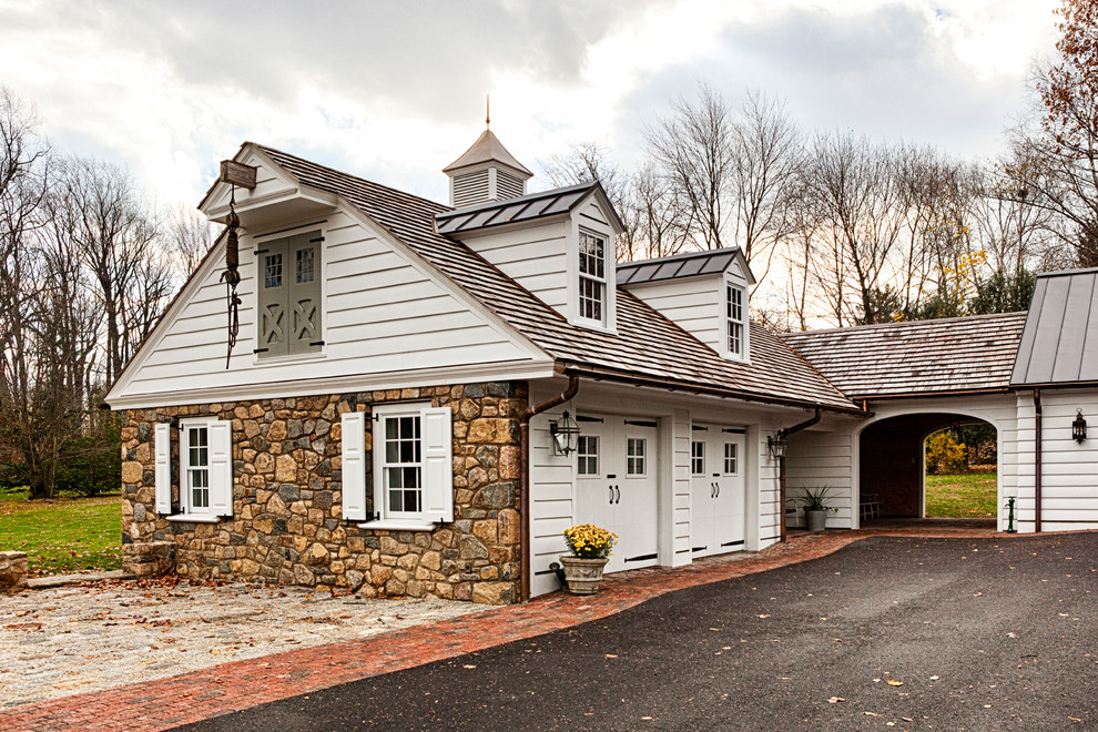 Photo of a large rural detached garage workshop in Philadelphia with four or more cars.