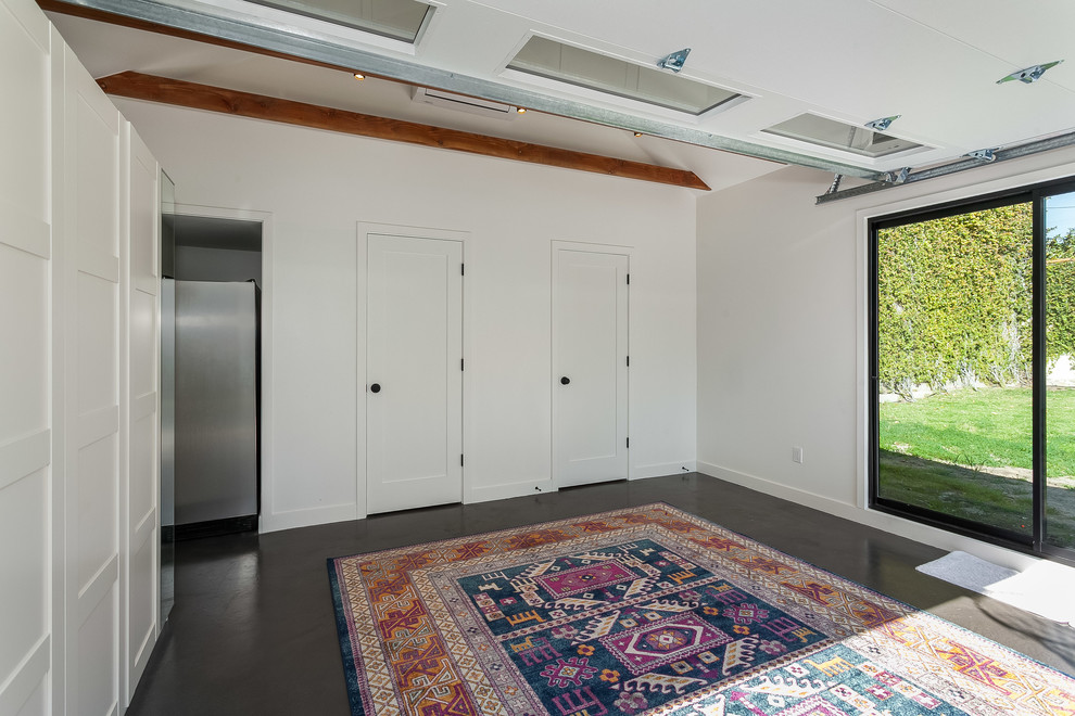 Mid-sized transitional detached two-car garage workshop photo in Los Angeles