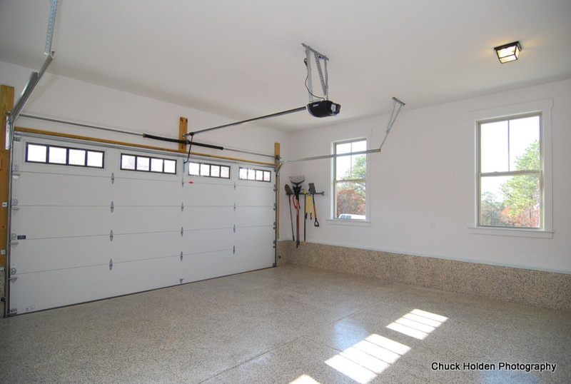 Example of a mid-sized classic attached two-car garage design in Other