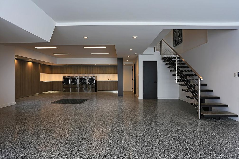 Huge minimalist attached three-car garage workshop photo in Los Angeles