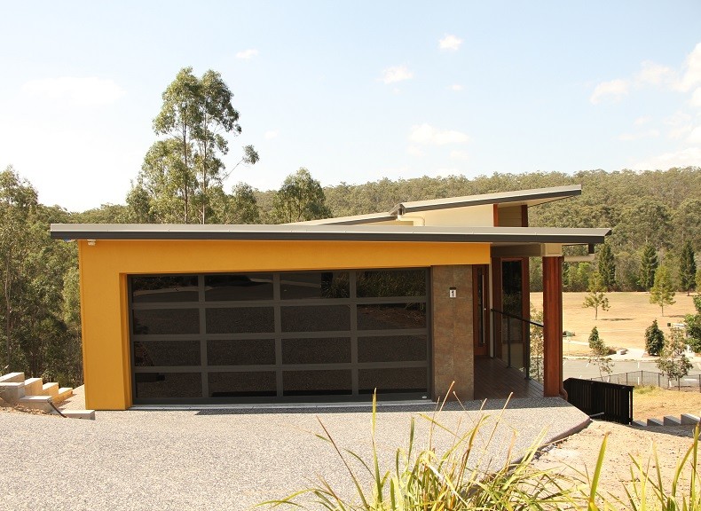 Inspiration for a modern attached double garage in Brisbane.