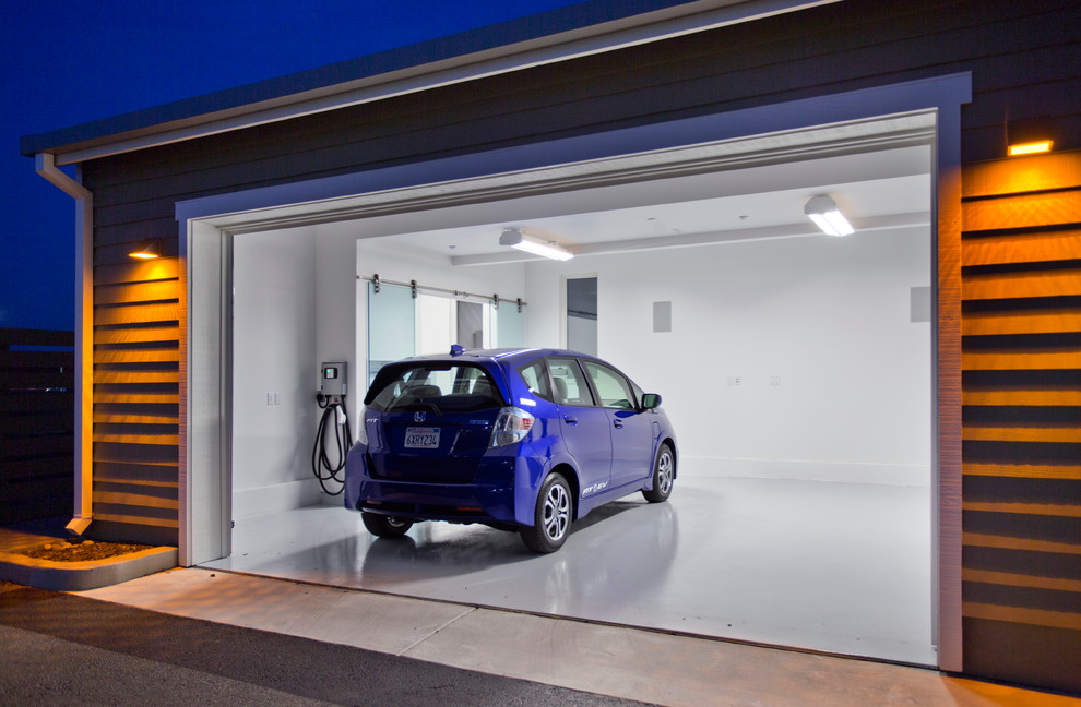 Example of a large trendy attached two-car garage workshop design in Sacramento