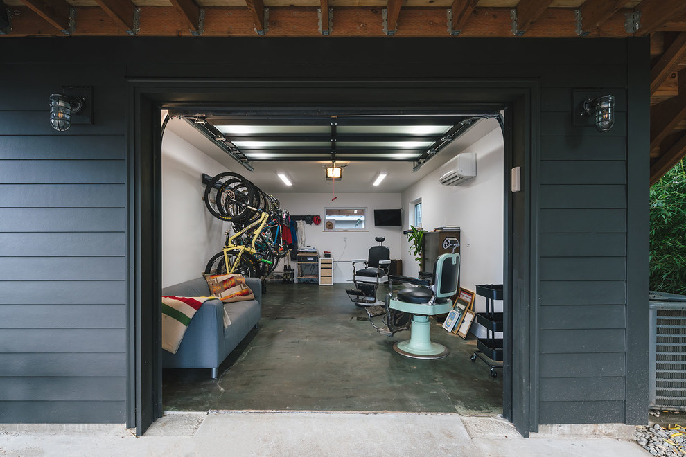 Garage - mid-sized contemporary attached one-car garage idea in Portland
