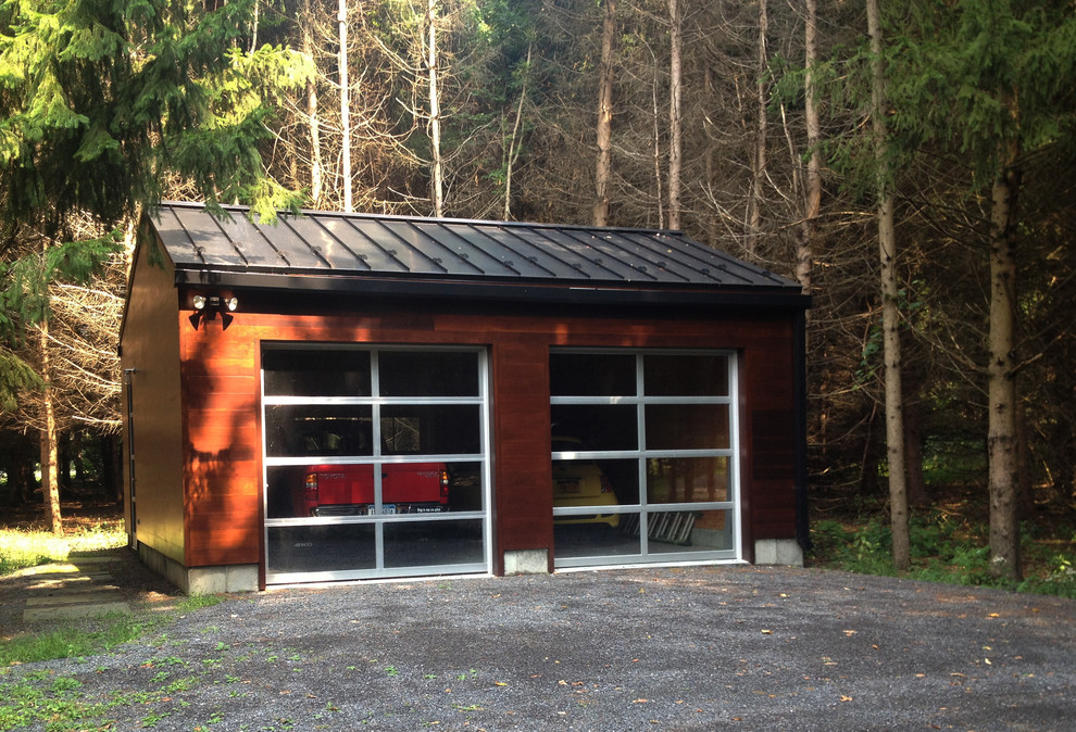 Cette image montre un petit garage pour deux voitures séparé minimaliste avec un bureau, studio ou atelier.