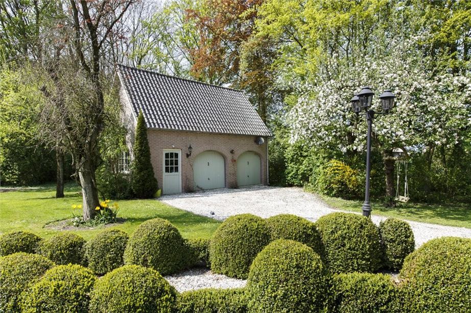 Inspiration for a medium sized farmhouse detached double garage in Amsterdam.