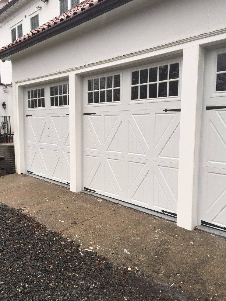 installation of 3 carriage style garage doors with 3 openers Modern