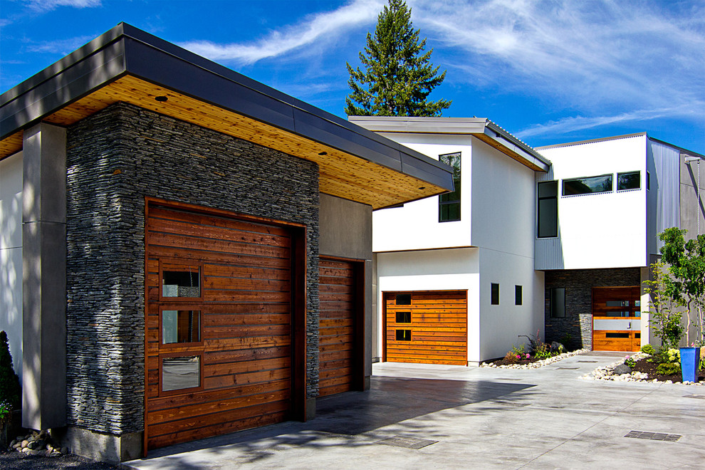 Exempel på en modern fristående garage och förråd