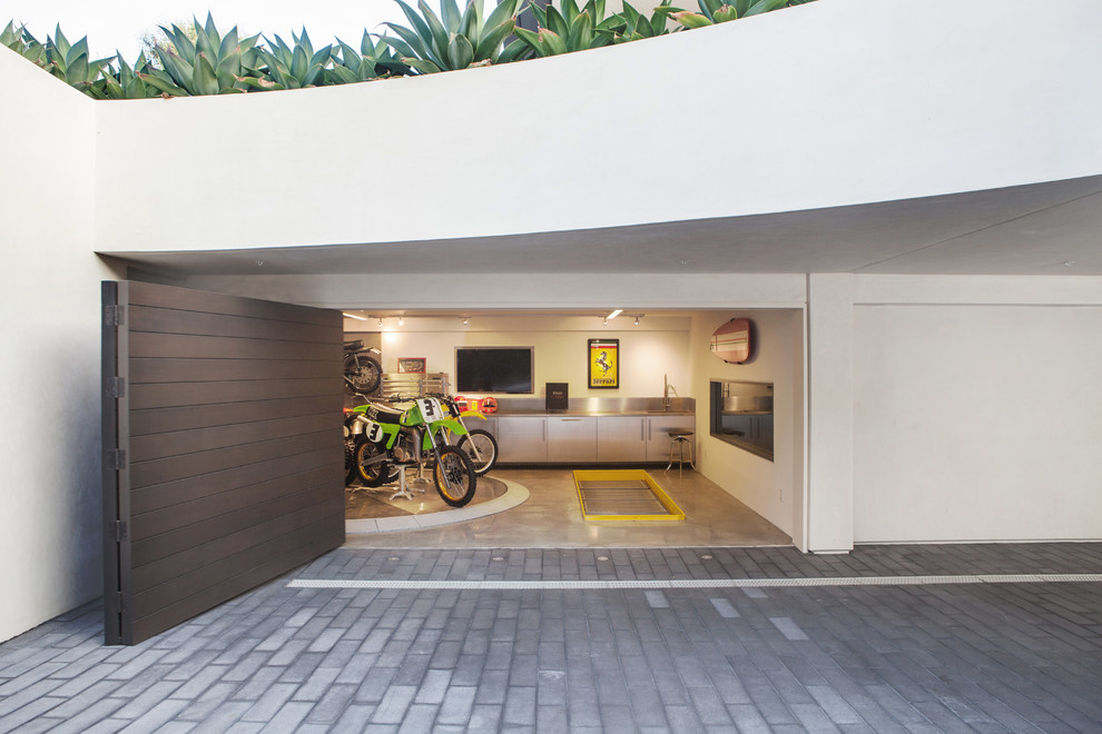 Mid-sized trendy attached two-car garage photo in Orange County