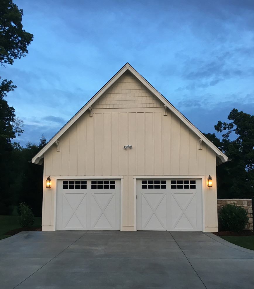 Garage - mid-sized cottage detached two-car garage idea in Louisville