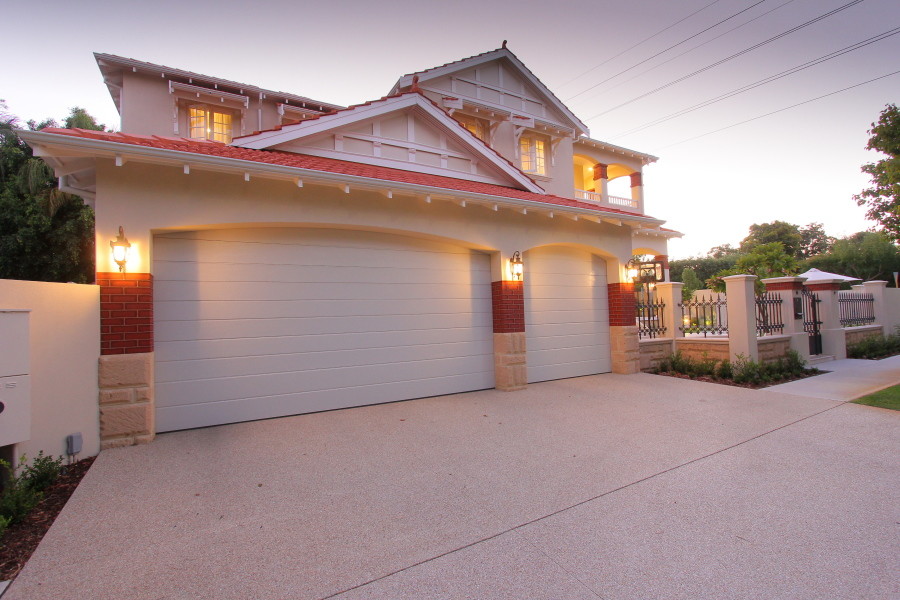 This is an example of a medium sized classic garage in Perth with three or more cars.