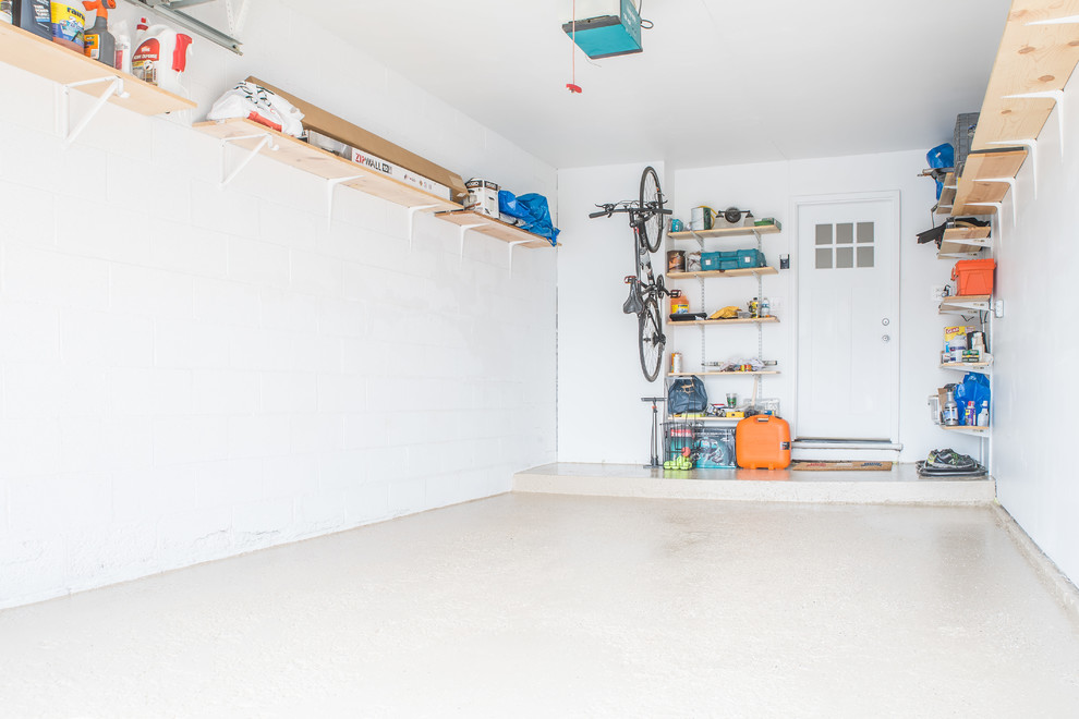 Small trendy attached one-car garage workshop photo in Chicago