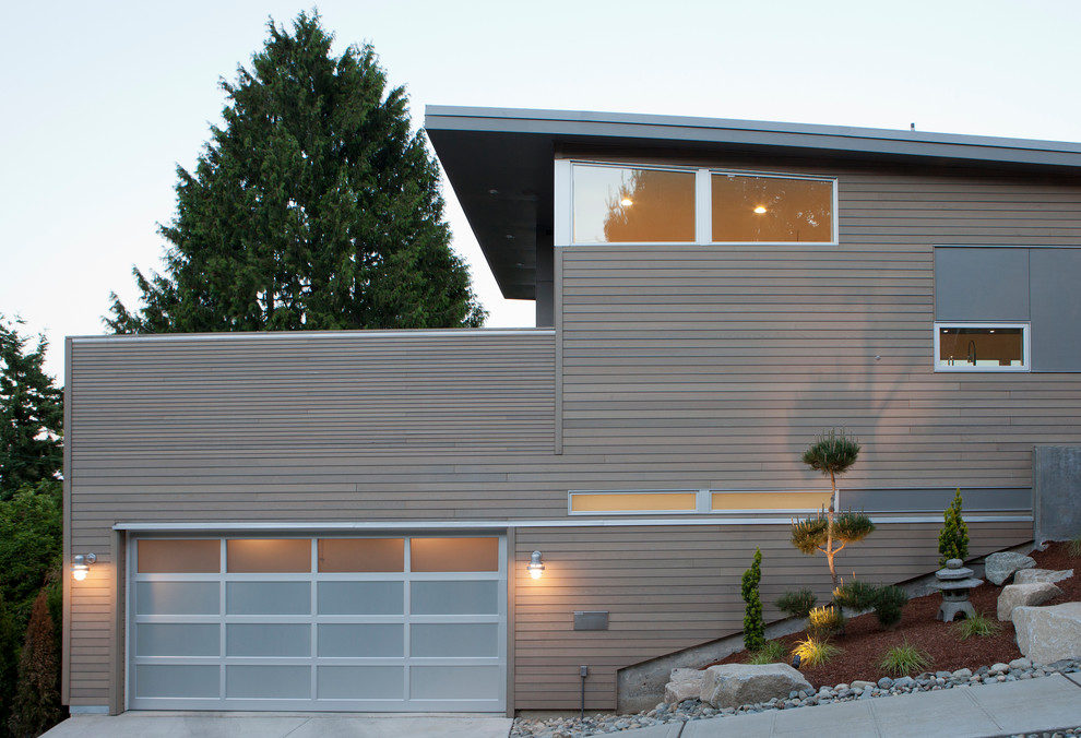 Large trendy attached two-car garage photo in Seattle