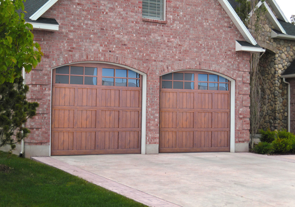 Example of a mid-sized classic attached two-car garage design in Seattle