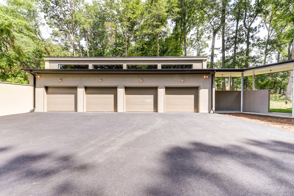 Пример оригинального дизайна: отдельно стоящий гараж в стиле модернизм для четырех и более машин