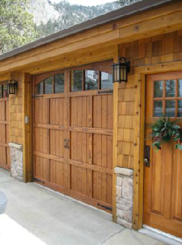 Inspiration for a large traditional attached double carport in Denver.