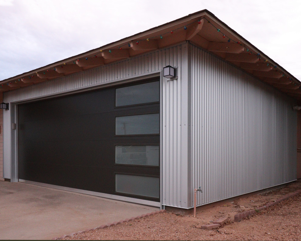 Idee per un garage per due auto connesso minimalista di medie dimensioni